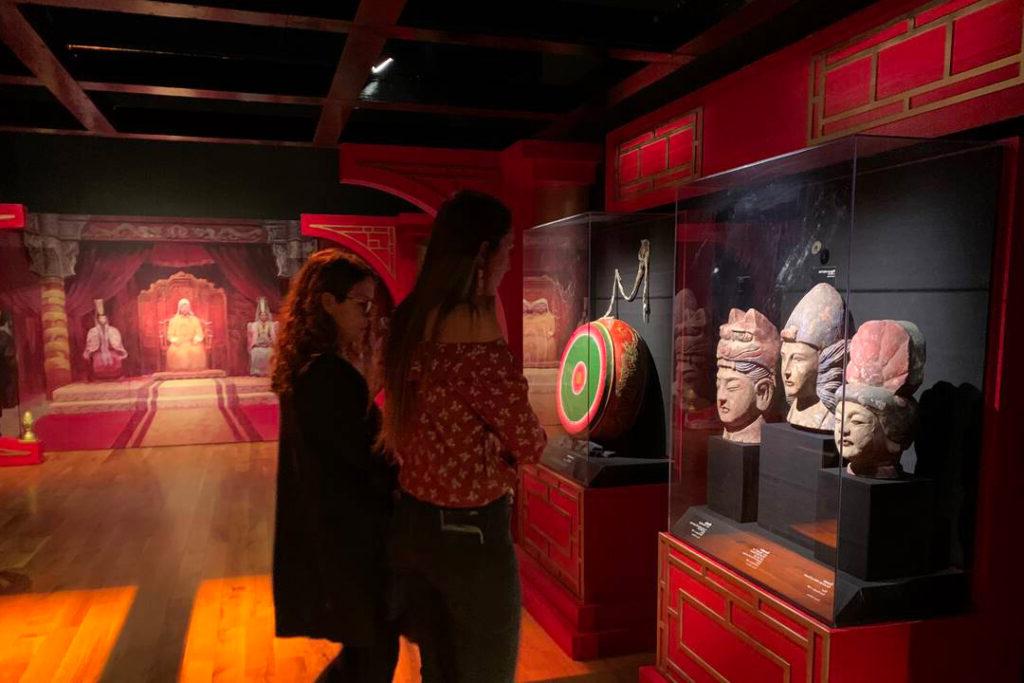 Students looking at an exhibit in a museum